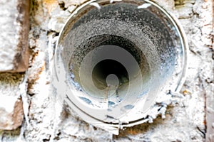 Interior view of dryer vent line with lint and dust buildup photo