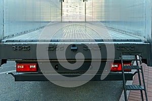 Interior view of an empty semi-trailer van for cargo transportation. The interior of a metal semi-trailer