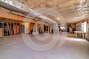 Interior view of a house under construction with plastic cover on the ceiling