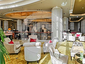 Interior view of a luxurious hotel, modern light chandelier in the hall