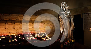 Interior view of Maria scuplture with candles in Cathedral Notre Dame de la garde in Marseille, France