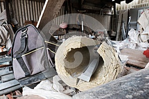 Interior view of a messy builders storage facility.