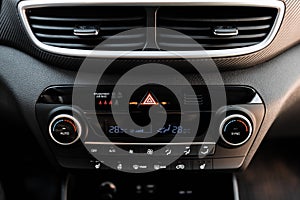 Interior view of a modern new car. Climatronic or air conditioner system