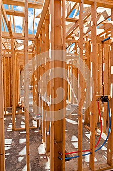 An interior view of a new home under construction with exposed w