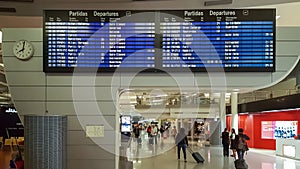 Interior view of the Porto airport building, with information departures board