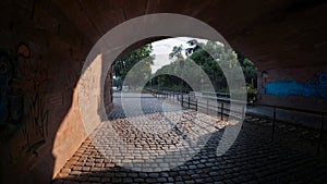Interior view of a stone bridge with a walkway also made of stone