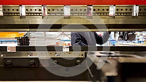 Interior view video of metal sheet bending machine at work in factory
