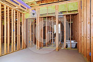 Interior wall framing with piping installation in the basement Bathroom remodel under floor plumbing work