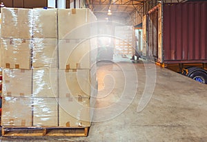 Interior of warehouse dock, Large pallet shipment boxes, Truck docking load cargo at warehouse