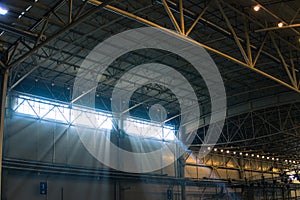 Interior of warehouse. large metal structures, ceiling. roof. concept production and installation of equipment for rooms, lighting