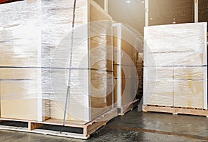 Interior of warehouse storage. Large shipment boxes on pallets.