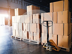 Interior of warehouse storage, stack package of shipment boxes on pallets.