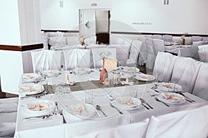 Interior of a wedding banquet hall with numerated tables photo