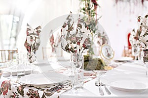 Interior of a wedding tent decoration ready for guests. Served round banquet table outdoor in marquee decorated flowers