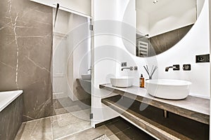 Interior of white modern bathroom in apartment