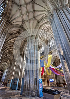Interior of Winchester Cathedral,with towering pillars.