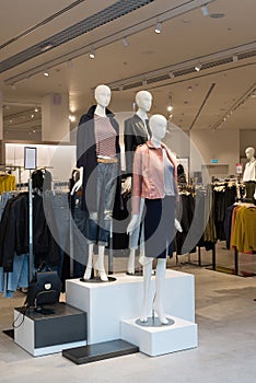 Interior of the womens clothing store with mannequins