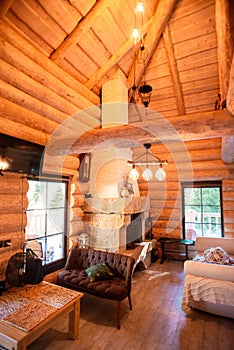 Interior of wood Chalet in mountains with chimney