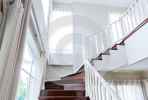 Interior wood stairs and handrail on background