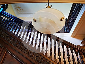Interior wooden railing - chandelier
