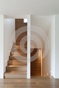 Interior, wooden staircase and parquet floor