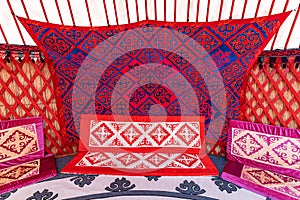 Interior of a Yurt. It is portable tent house in the culture of Central Asian nomadic peoples. Ethnic and folk patterns for home photo