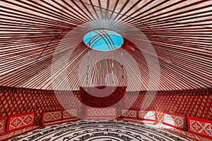 Interior of Yurt. It is a portable tent house in the culture of Central Asian nomadic peoples. Ethnic and folk patterns for home photo