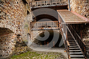 The interiors of gothic medieval castle tower, wooden stairs and floors, fortress masonry wall, old stronghold, Velhartice,