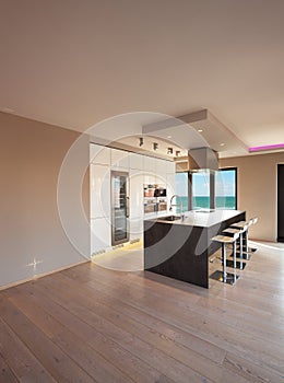 Interiors of a modern apartment, kitchen with sea view