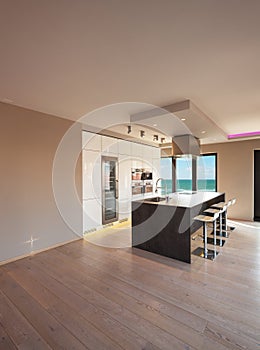 Interiors of a modern apartment, kitchen with sea view photo