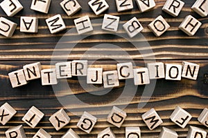 interjection - word from wooden blocks with letters