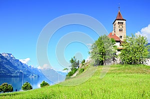 INTERLAKEN, SWITZERLAND, JUNE 01, 2018: Beautiful church to the Brienz town on lake Brienz by Interlaken