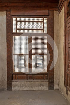 Interleaved grunge wooden window Mashrabiya, Cairo, Egypt photo