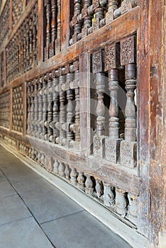 Interleaved wooden ornate wall - Mashrabiya -at abandoned building photo