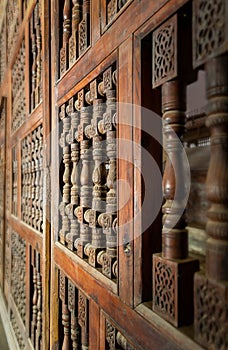 Interleaved wooden ornate wall - Mashrabiya -at abandoned building photo