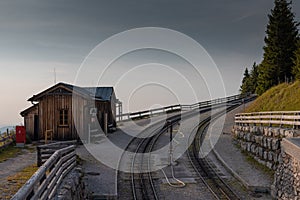 Intermediate station of narrow cog railway on the shafberg mountain in upper austria. Romantic view of old train track high up on