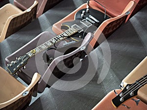 At intermission, rock guitarists laid their guitars parallel to each other on different rows in the auditorium