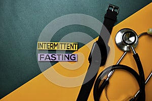 Intermittent Fasting text on top view color table and Healthcare/medical concept