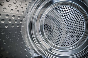 Internal closeup view of dryer stainless steel drum.
