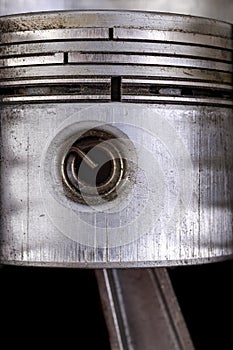 Internal combustion engine piston mounted in the cylinder. View of the piston and rings in the engine