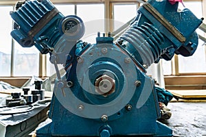 Internal combustion engine in a repair shop, view from the back