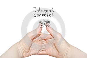 Internal conflict inscription.Two women`s hands of the same person, interlock fingers on white background. Clasped Hands photo