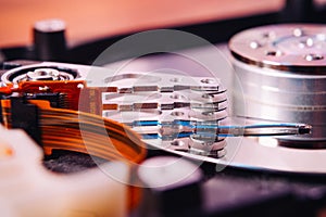 Internal hard disk closeup on wooden background