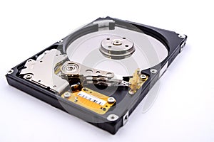 Internal parts of a hard disk isolated on a white background. Close up of Hard disk drive inside view