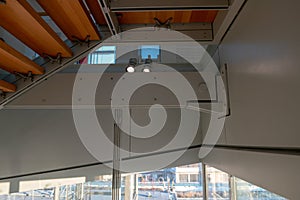 internal staircase in wood and steel, suspended. construction detail of the steel structure for a double turntable staircase.