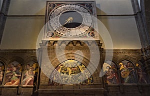 Internal wall, with clock and frescoes, of the cathedral of Santa Maria in Fiore in Florence.