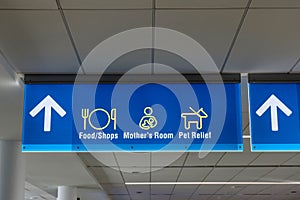 International Airport sign Food Shops Mothers Room Pet Relief in air terminal