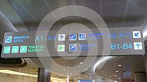 International Airport sign to Gates and baggage claims and toilette
