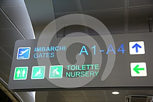 International Airport sign to Gates and baggage claims and toilette