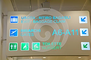 International Airport sign to Gates and baggage claims and toilette